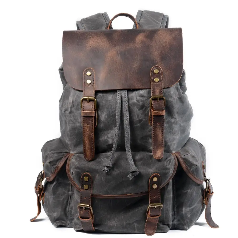 Sac à dos vintage homme en toile cirée, rabat en cuir de vachette 3 Sac à dos vintage homme en toile cirée, rabat en cuir de vachette, vue de face