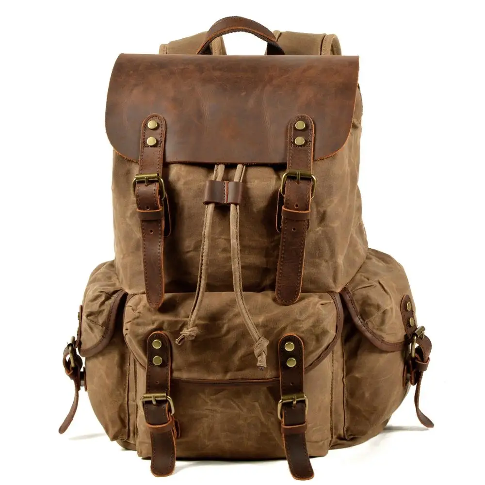 Sac à dos vintage homme en toile cirée, rabat en cuir de vachette 6 Sac à dos vintage homme en toile cirée, rabat en cuir de vachette, vue de profil