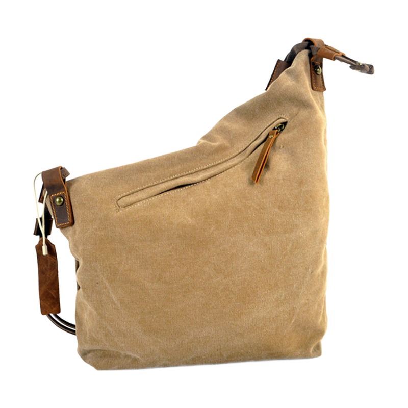 Sacoche bandoulière homme en toile et cuir, forme souple rétro 2 Sacoche bandoulière homme en toile et cuir, forme souple rétro, vue de trois quarts