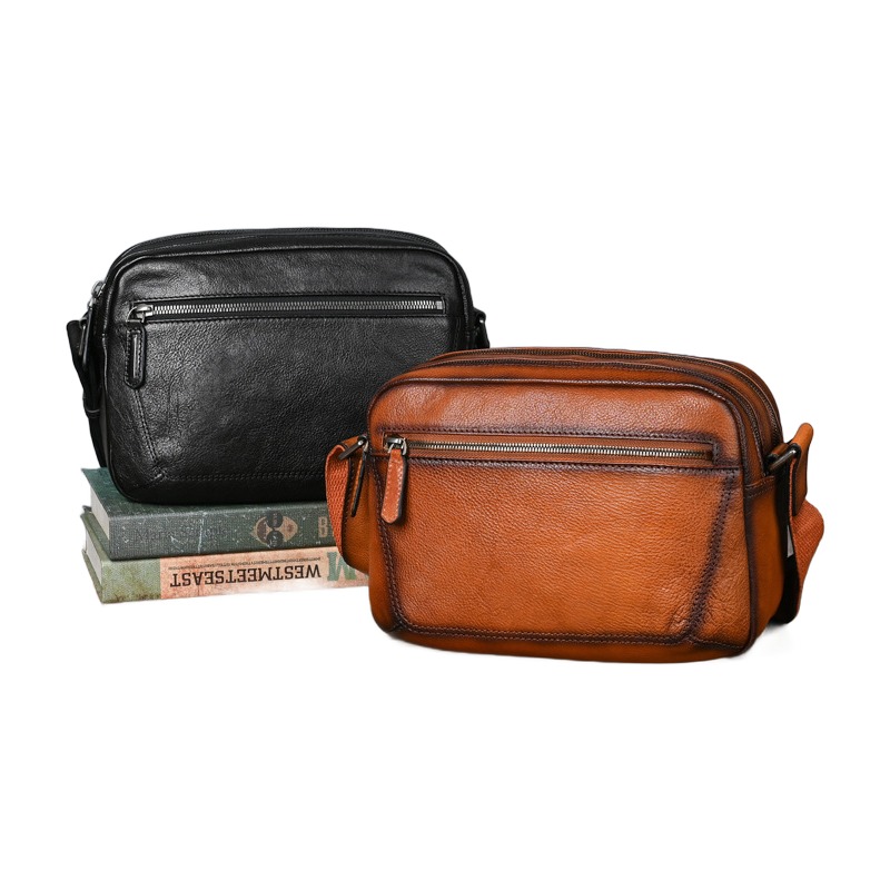 Sacoche homme cuir véritable rétro à poche avant zippée 2 Sacoche homme cuir véritable rétro à poche avant zippée, vue de trois quarts